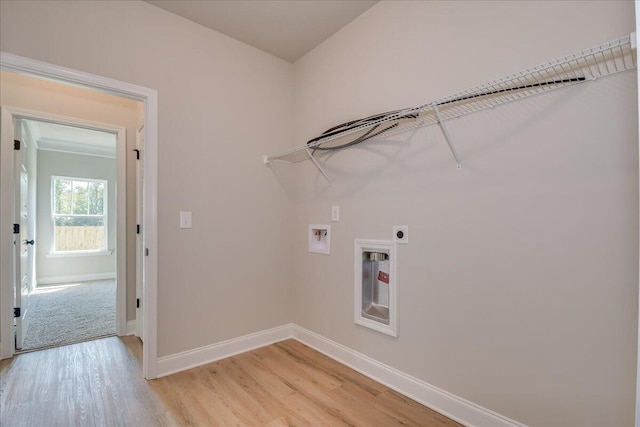 laundry room featuring washer hookup, electric dryer hookup, and light wood-type flooring