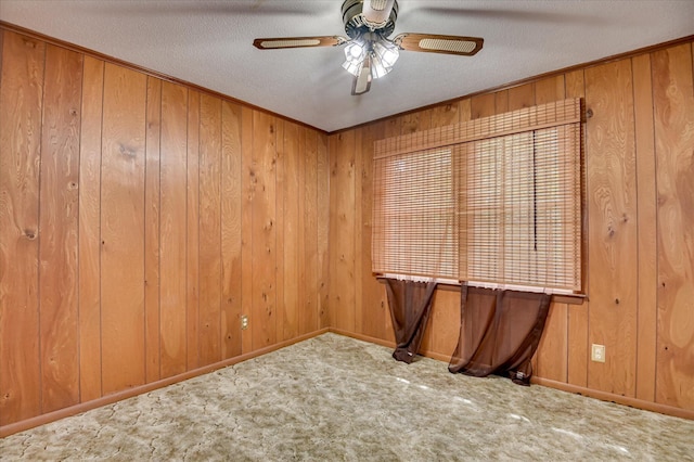3115 Arcadia Dr, Augusta, GA 30906 - carpeted spare room with a ceiling fan, wood walls, and a textured ceiling
