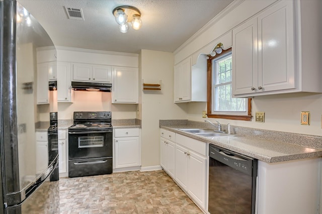 3115 Arcadia Dr, Augusta, GA 30906 - kitchen with black appliances, under cabinet range hood, white cabinetry, a textured ceiling, and arched walkways