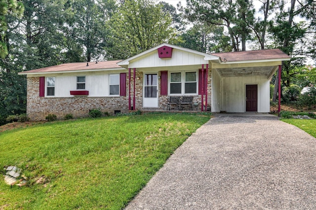 3115 Arcadia Dr, Augusta, GA 30906 - single story home with driveway, a front lawn, a carport, and brick siding