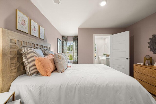 bedroom featuring connected bathroom