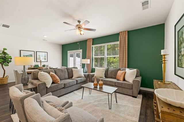 living room featuring ceiling fan and light hardwood / wood-style flooring