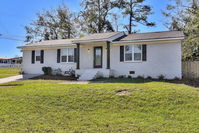 ranch-style house featuring a front lawn