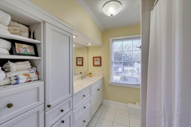 bathroom featuring vanity, tile patterned floors, and walk in shower