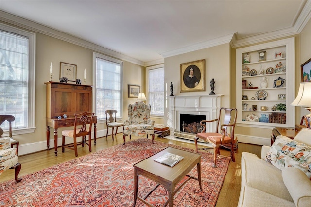 living room with ornamental molding and a healthy amount of sunlight