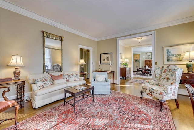 living room featuring hardwood / wood-style flooring and crown molding