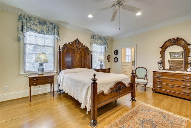 bedroom with ornamental molding, light hardwood / wood-style floors, and ceiling fan