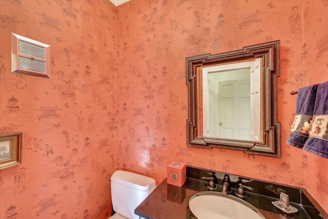 bathroom featuring toilet and sink