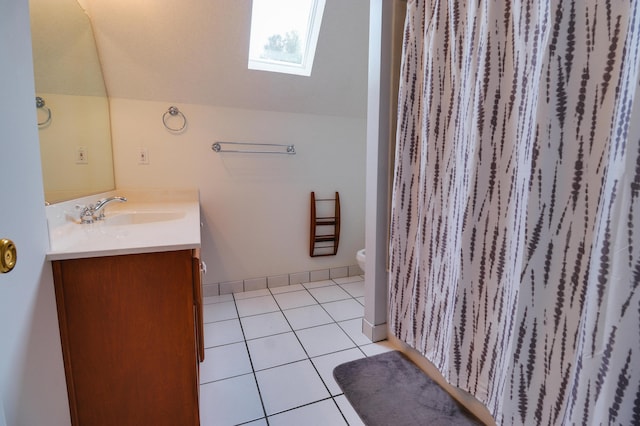 902 Patriots Pt, Mccormick, SC 29835 - full bathroom with vanity, a skylight, toilet, tile patterned flooring, and vaulted ceiling
