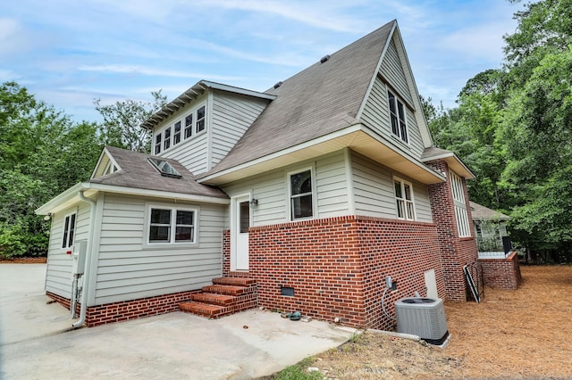 902 Patriots Pt, Mccormick, SC 29835 - rear view of property with entry steps, central AC, a shingled roof, and a patio