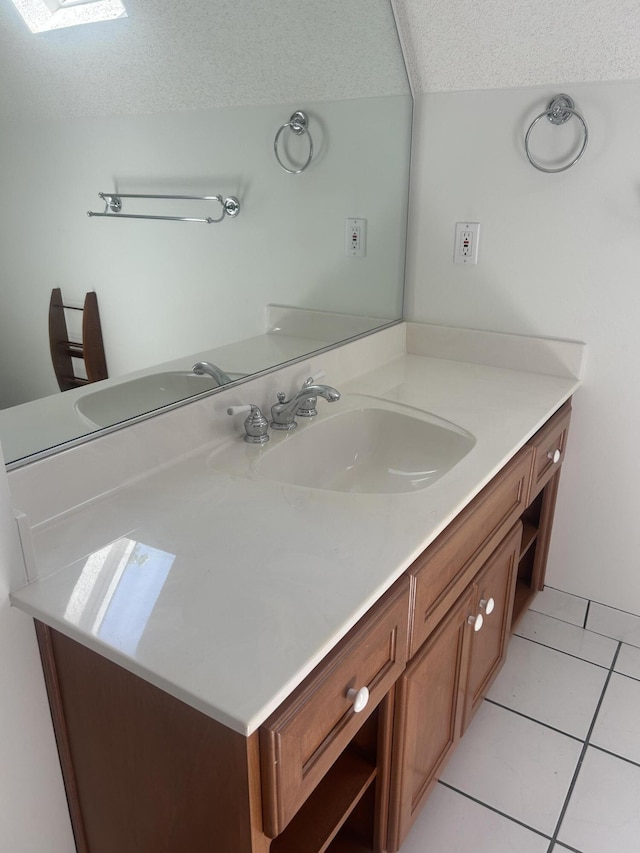 902 Patriots Pt, Mccormick, SC 29835 - bathroom featuring vanity, tile patterned floors, a textured ceiling, and a skylight