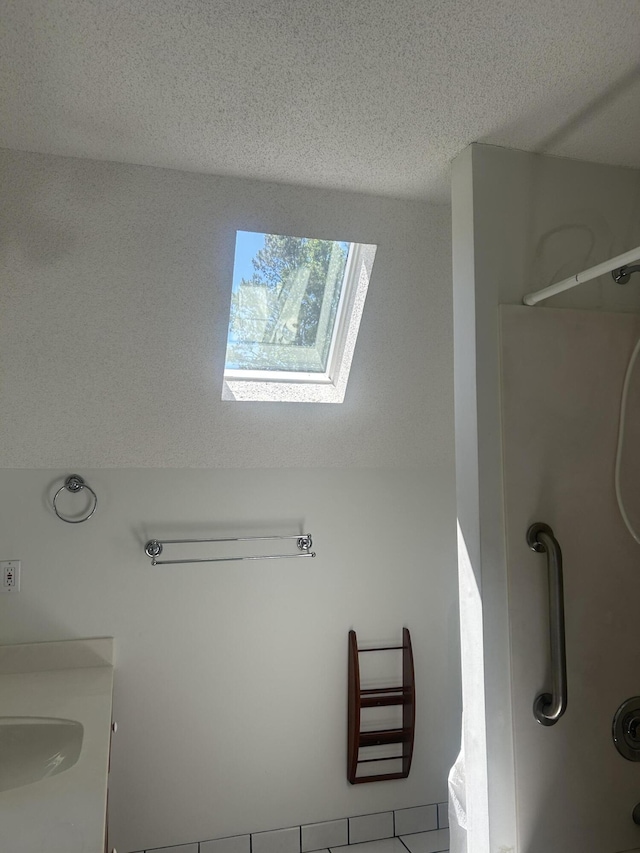 902 Patriots Pt, Mccormick, SC 29835 - full bath featuring a skylight, a shower, a textured ceiling, and vanity