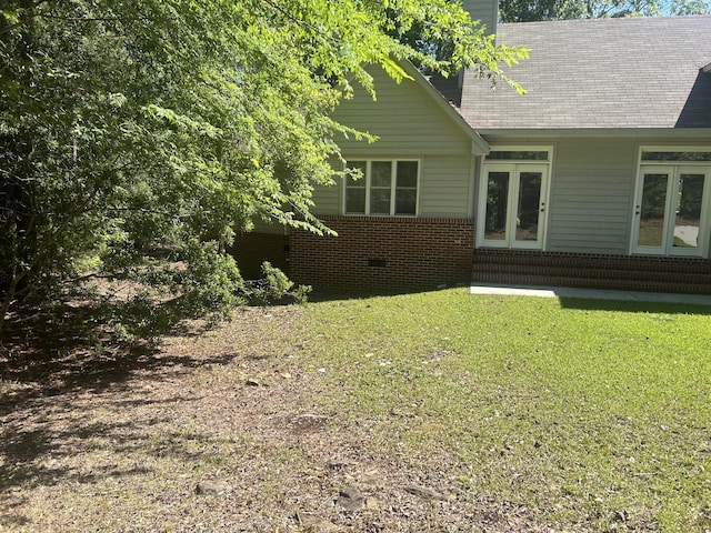 902 Patriots Pt, Mccormick, SC 29835 - rear view of house featuring a yard, a chimney, and brick siding