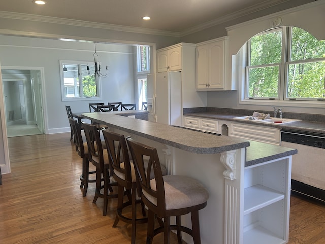 902 Patriots Pt, Mccormick, SC 29835 - kitchen with white refrigerator with ice dispenser, dishwashing machine, a sink, healthy amount of natural light, and ornamental molding