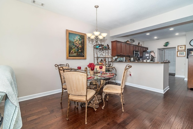 1215 Brookstone Way, Augusta, GA 30909 - dining area featuring a chandelier, dark wood-style flooring, and recessed lighting