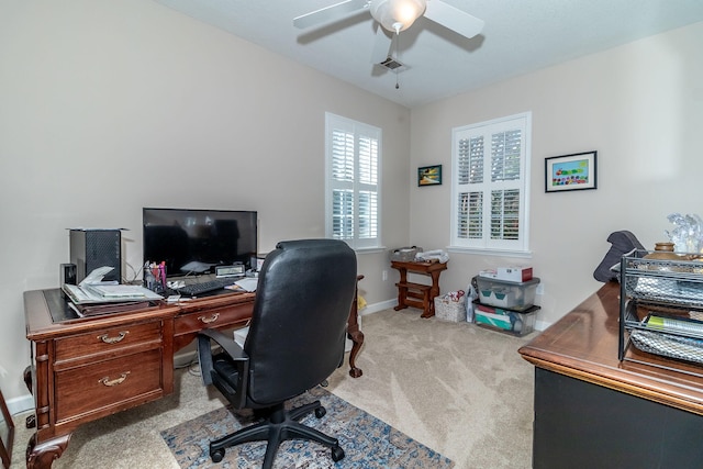 carpeted office featuring ceiling fan