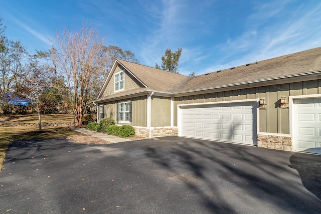 view of side of home with a garage