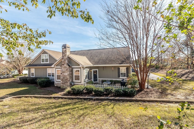 1215 Brookstone Way, Augusta, GA 30909 - view of front of house featuring a chimney, a front yard, and stone siding