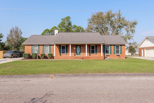 ranch-style house with a front lawn, a porch, and a garage