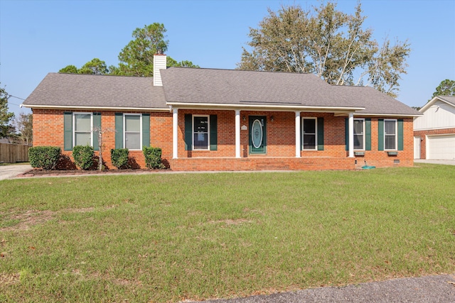 ranch-style home with a garage and a front lawn