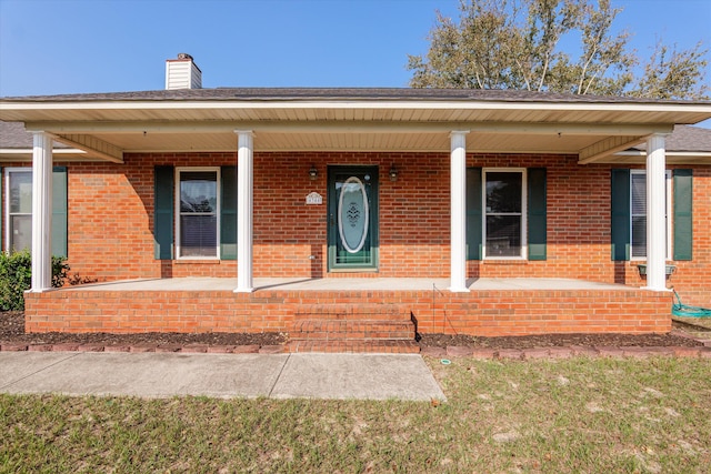 property entrance with covered porch