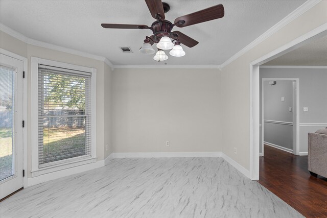 spare room featuring a textured ceiling, light hardwood / wood-style flooring, ceiling fan, and ornamental molding