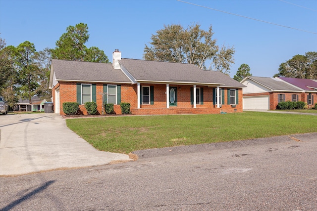 ranch-style home with a front yard and a garage