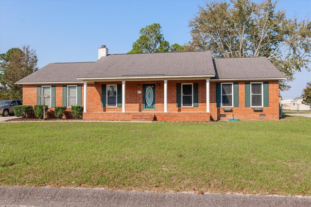 ranch-style home with a front yard