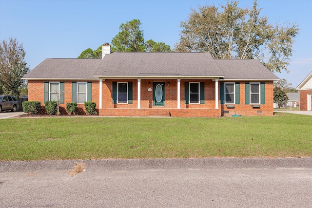 single story home featuring a front yard