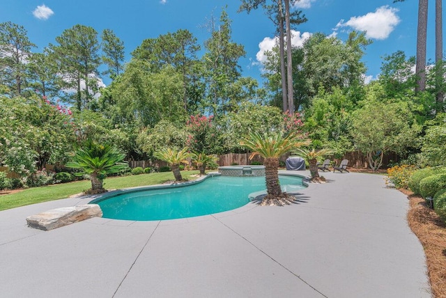 506 Creek Blf, Martinez, GA 30907 - view of swimming pool with a patio, a fenced backyard, view of wooded area, and an in-ground hot tub