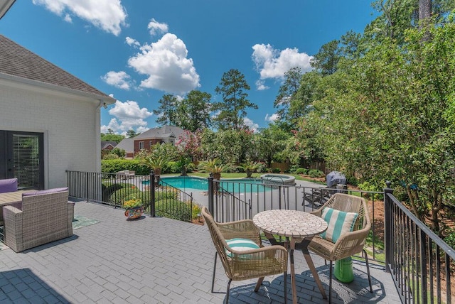506 Creek Blf, Martinez, GA 30907 - view of patio featuring outdoor dining area and a pool with connected hot tub