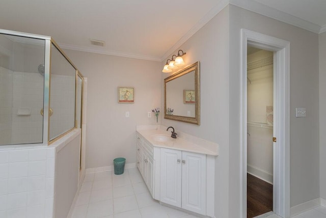 506 Creek Blf, Martinez, GA 30907 - bathroom featuring tiled shower, vanity, crown molding, a spacious closet, and tile patterned flooring