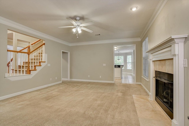 1123 Blackfoot Dr, Evans, GA 30809 - unfurnished living room featuring ceiling fan, light colored carpet, a fireplace, crown molding, and stairway