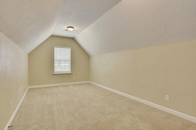 1123 Blackfoot Dr, Evans, GA 30809 - additional living space featuring light colored carpet, lofted ceiling, and a textured ceiling