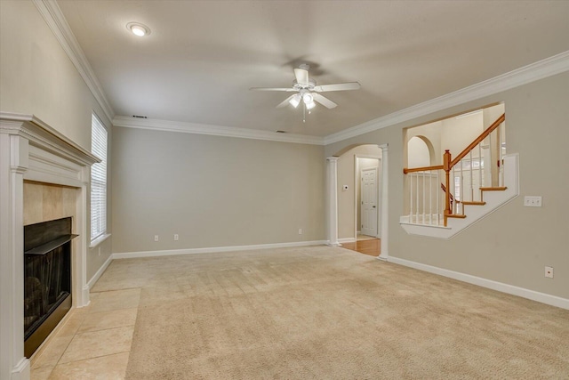 1123 Blackfoot Dr, Evans, GA 30809 - unfurnished living room with ceiling fan, arched walkways, a fireplace, crown molding, and decorative columns