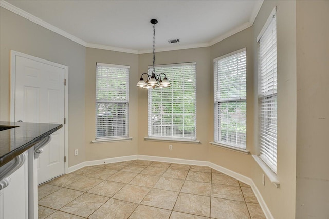 1123 Blackfoot Dr, Evans, GA 30809 - unfurnished dining area featuring plenty of natural light, ornamental molding, a chandelier, and light tile patterned flooring