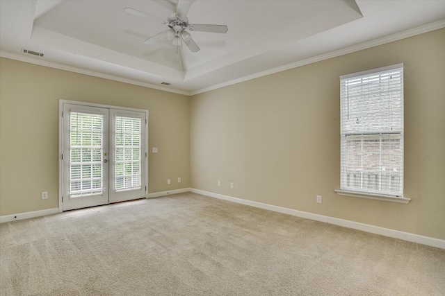 1123 Blackfoot Dr, Evans, GA 30809 - carpeted spare room featuring a tray ceiling, ceiling fan, french doors, and crown molding
