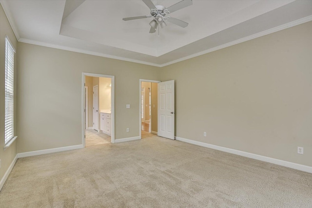 1123 Blackfoot Dr, Evans, GA 30809 - unfurnished bedroom featuring light carpet, a raised ceiling, crown molding, and ensuite bathroom