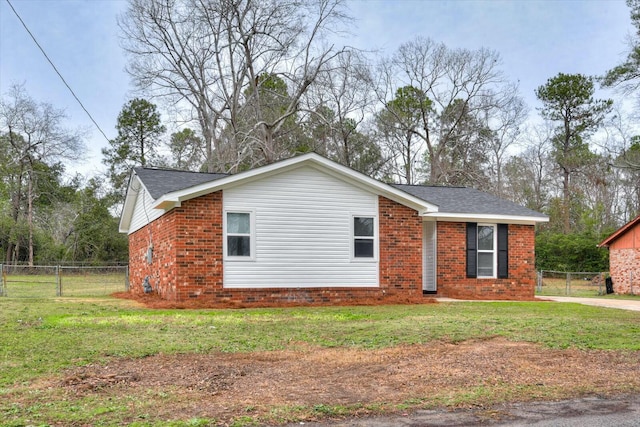 view of home's exterior with a yard