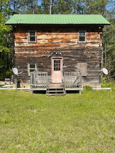 view of outbuilding with a lawn