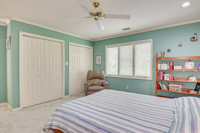 3725 Wexford Dr, Martinez, GA 30907 - carpeted bedroom featuring multiple closets, ornamental molding, and ceiling fan