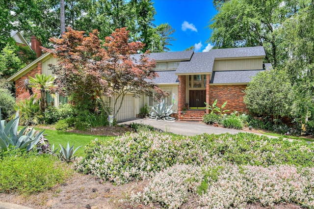 3725 Wexford Dr, Martinez, GA 30907 - view of front facade with a shingled roof, concrete driveway, a garage, and brick siding