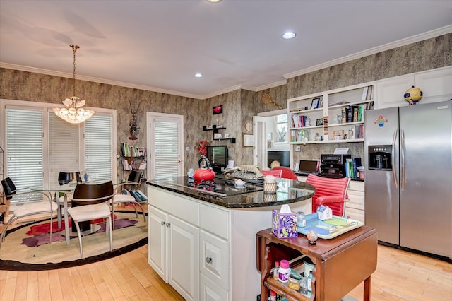 3725 Wexford Dr, Martinez, GA 30907 - kitchen featuring stainless steel appliances, light wood-style flooring, a chandelier, white cabinets, and ornamental molding