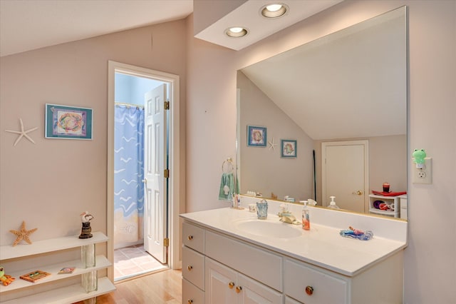 3725 Wexford Dr, Martinez, GA 30907 - bathroom featuring vanity, lofted ceiling, wood finished floors, and recessed lighting