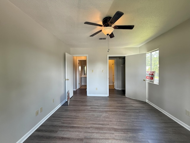 1017 Stevens Creek Rd, Augusta, GA 30907 - unfurnished bedroom featuring dark wood finished floors, a textured ceiling, a ceiling fan, and a closet
