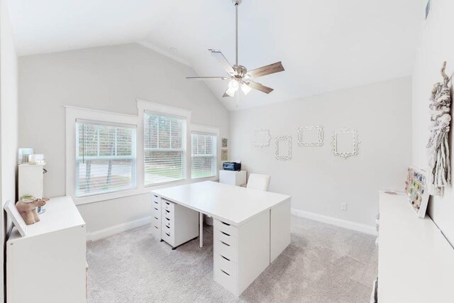 carpeted office featuring vaulted ceiling and ceiling fan