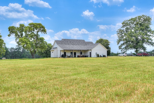 1839 Joyner Pond Rd, Aiken, SC 29803 - view of front facade with board and batten siding, a front yard, and roof with shingles