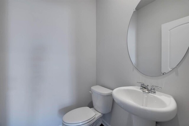 bathroom featuring sink and toilet