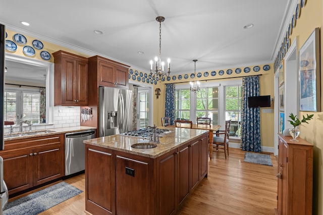 1201 Reid Rd, Augusta, GA 30909 - kitchen with a healthy amount of sunlight, an inviting chandelier, appliances with stainless steel finishes, and a sink