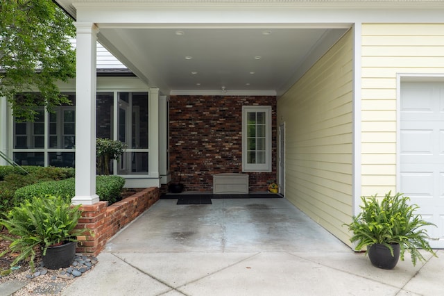 1201 Reid Rd, Augusta, GA 30909 - doorway to property featuring a garage and brick siding